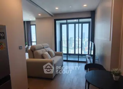 Modern living room with city view and cozy seating area