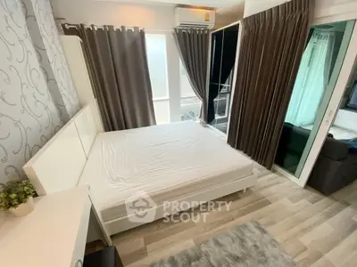 Modern bedroom with stylish decor and large windows for natural light