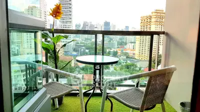 Charming balcony with city view, perfect for relaxation and enjoying the skyline.