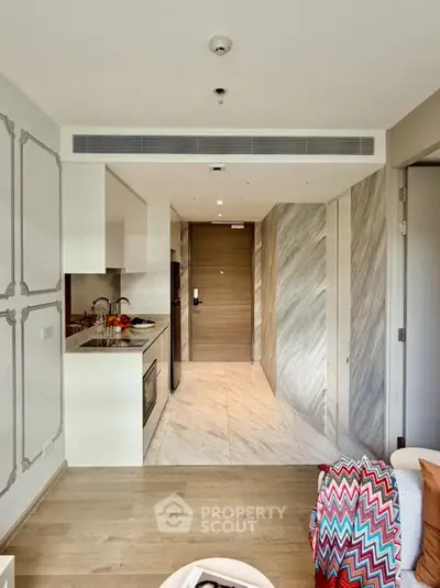 Modern open-layout kitchen with sleek design and stylish decor