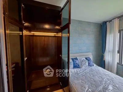 Spacious bedroom with elegant wardrobe and cozy bed, perfect for modern living.