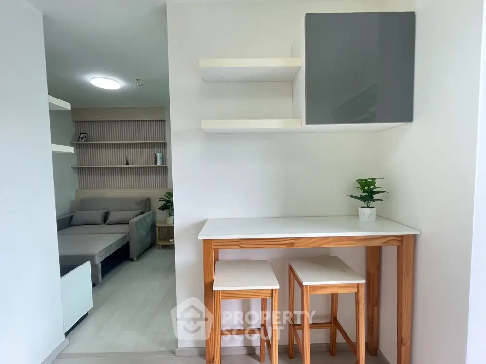 Modern minimalist living space with cozy seating and stylish decor