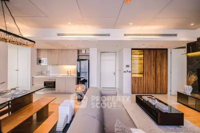 Luxurious modern living room with open kitchen layout and stylish decor