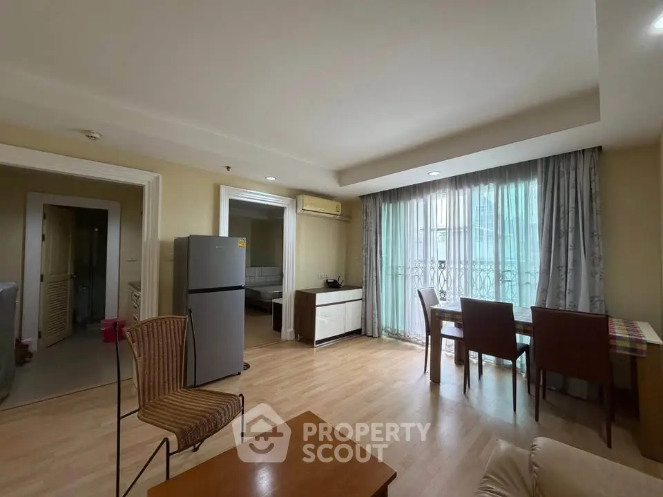 Spacious living room with dining area and natural light