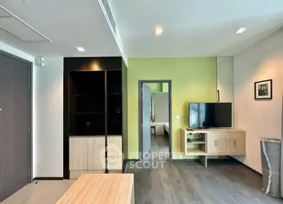 Modern living room with sleek design and vibrant green accent wall