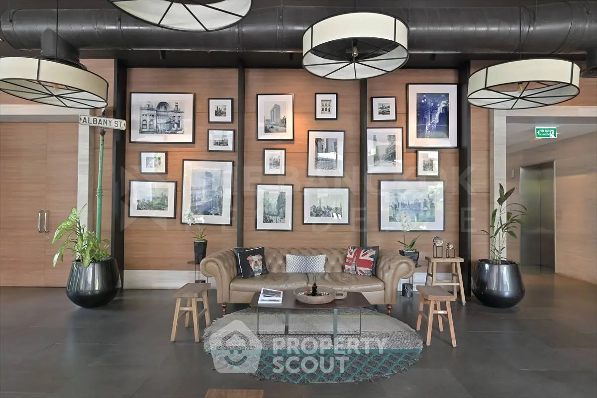 Stylish lobby with modern decor and gallery wall in upscale building