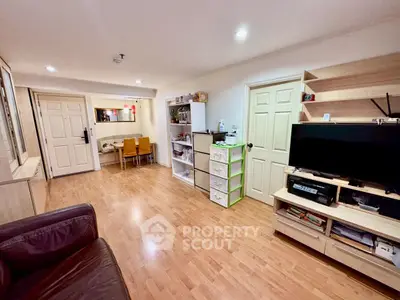 Spacious living room with wooden flooring and modern furnishings