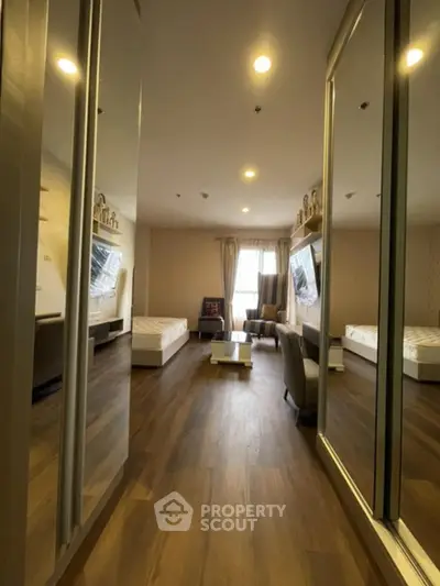 Spacious modern living room with wooden flooring and stylish decor