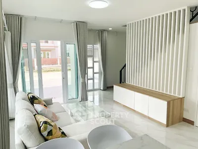 Modern living room with large windows and stylish decor