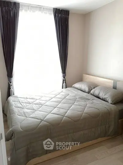 Cozy bedroom with modern decor and natural light