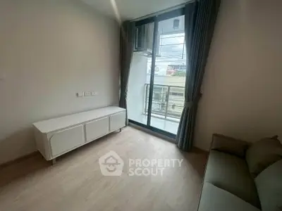 Modern living room with balcony access and natural light