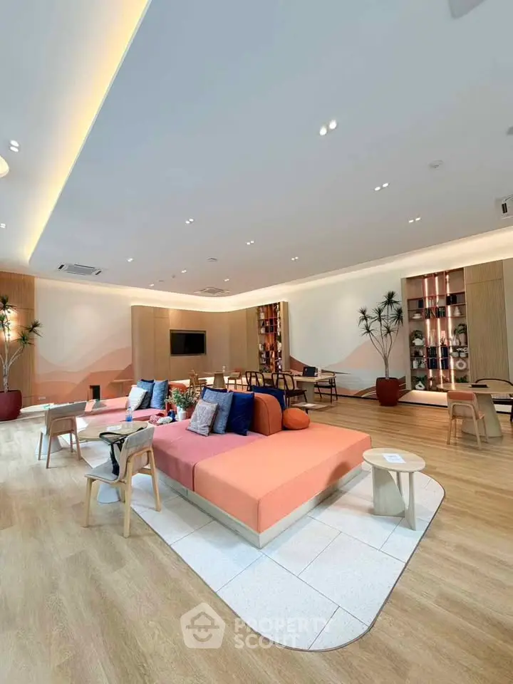 Spacious modern living room with stylish decor and ample seating in a luxurious setting.