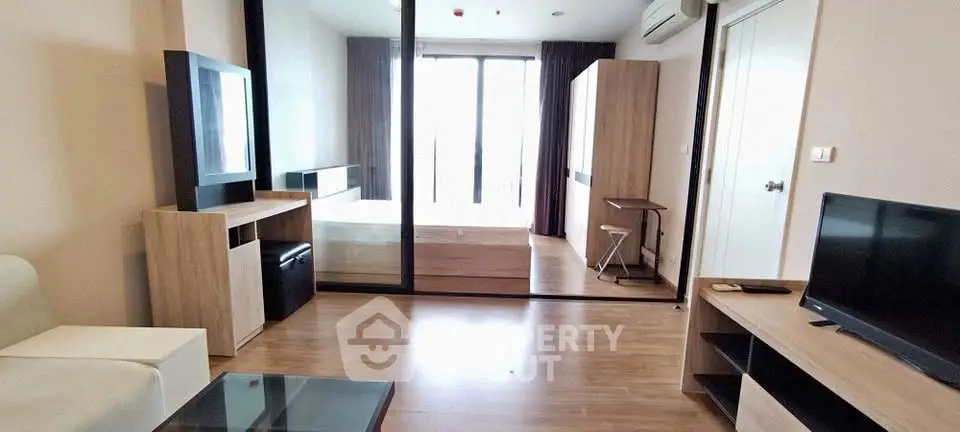 Modern studio apartment with sleek wooden flooring and stylish furniture