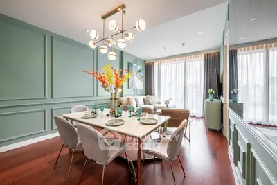 Luxurious dining and living area with elegant decor and natural light