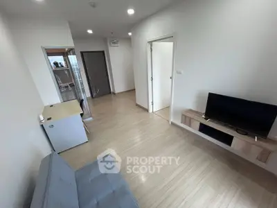 Modern living room with minimalist decor and sleek wooden flooring