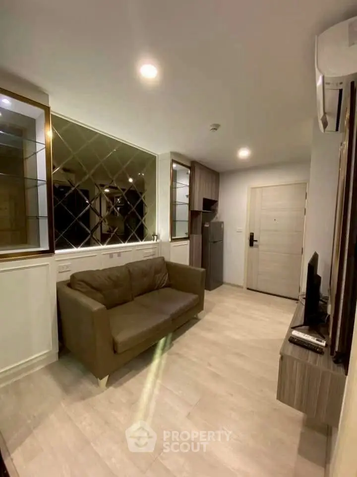 Modern living room with sleek design and cozy sofa in a stylish apartment.