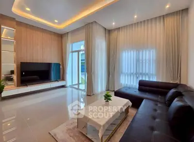 Spacious modern living room with elegant decor and large windows