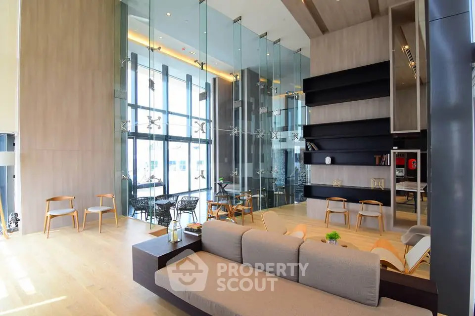 Luxurious modern living room with high ceilings and elegant decor in a contemporary apartment.