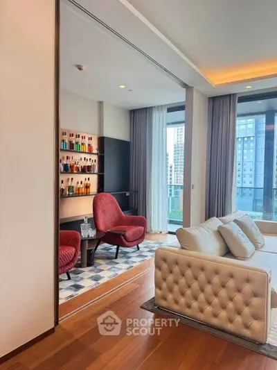 Luxurious living room with elegant decor and city view, featuring plush seating and stylish shelving.