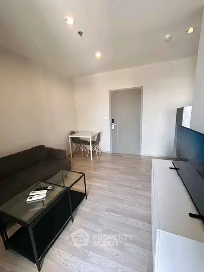 Modern living room with sleek furniture and minimalist design, perfect for urban living.