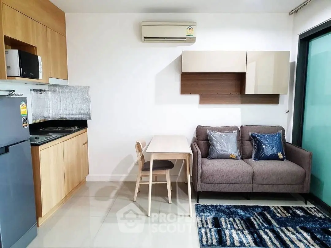 Modern compact living room with kitchenette and stylish decor