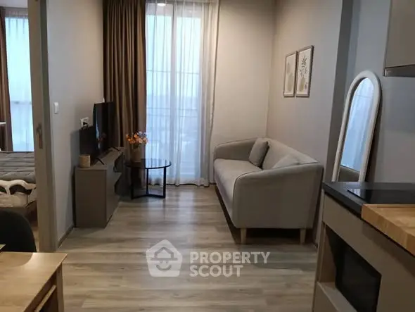 Modern living room with cozy sofa and TV, perfect for relaxation.