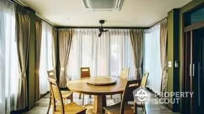 Elegant dining room with round table and natural light