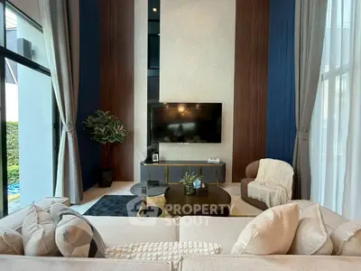 Luxurious modern living room with high ceilings and elegant decor