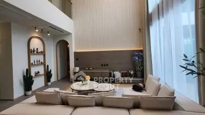 Luxurious modern living room with high ceilings and elegant decor