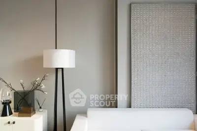 Modern living room with stylish decor and elegant floor lamp