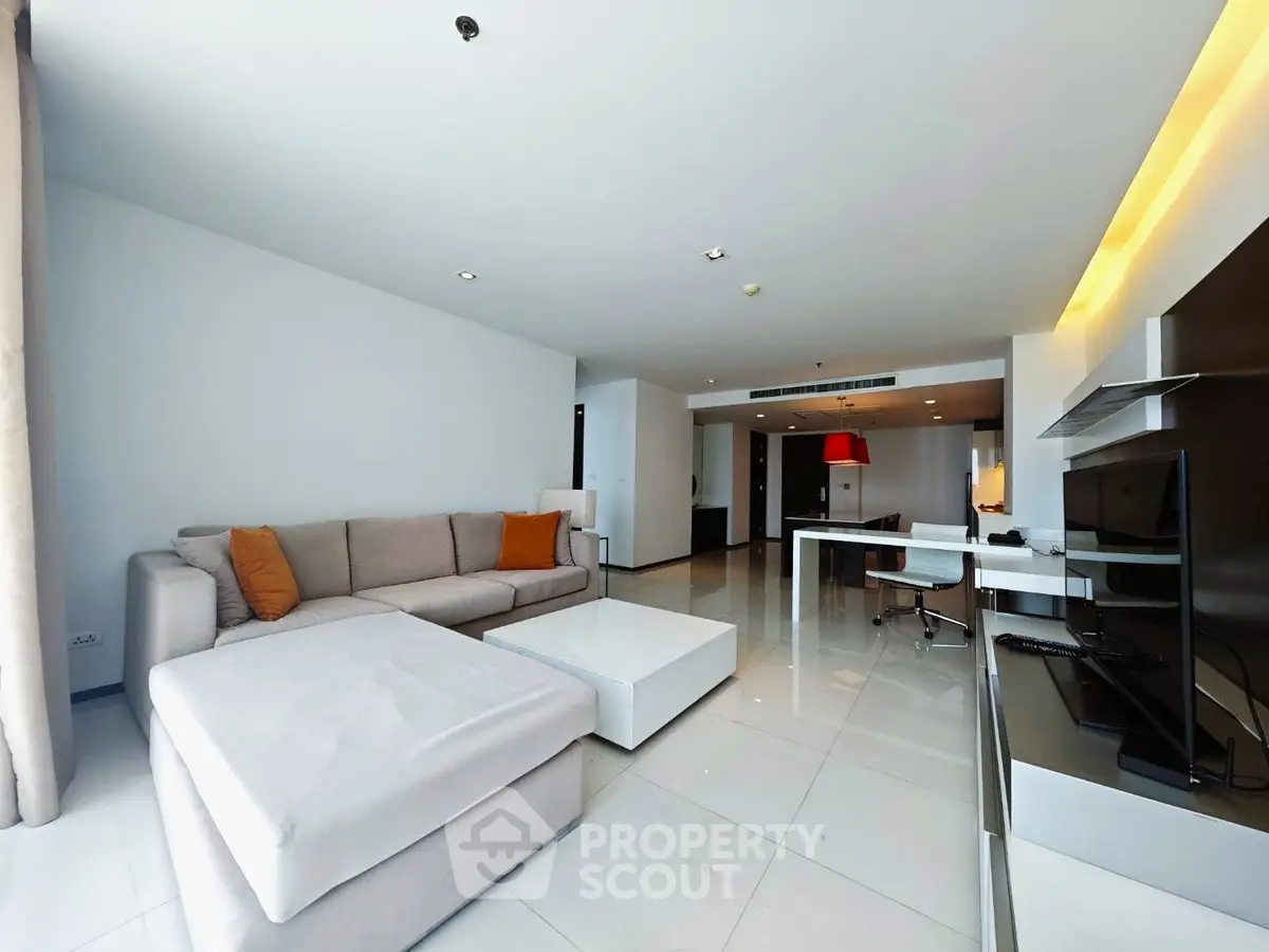 Spacious modern living room with sleek furniture and open layout