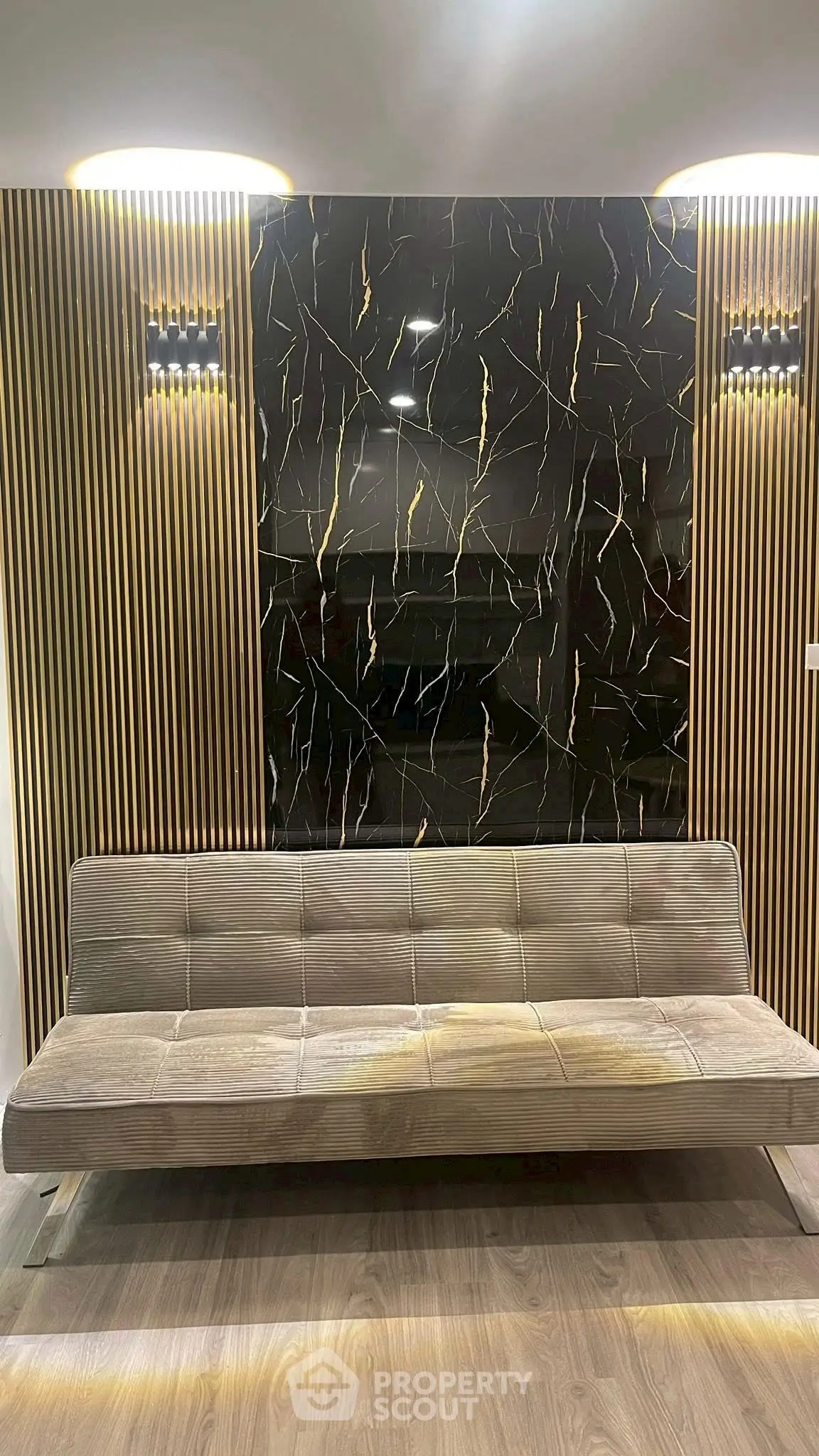 Stylish modern living room with elegant sofa and decorative wall paneling