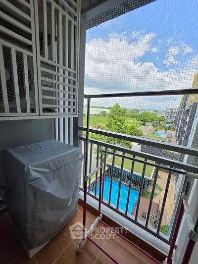 Charming balcony with pool view, perfect for relaxation and enjoying the outdoors.