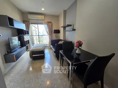 Modern living room with sleek furniture and city view from balcony, perfect for urban living.