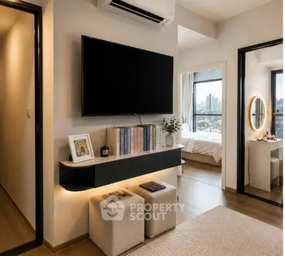 Modern living room with wall-mounted TV and view into a stylish bedroom