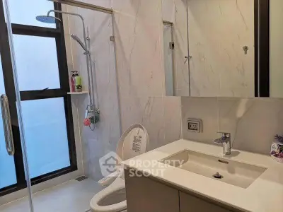 Modern bathroom with sleek fixtures and large window for natural light.