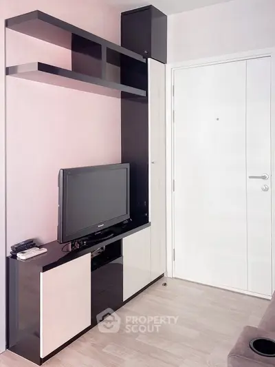 Modern living room with sleek TV unit and stylish shelving