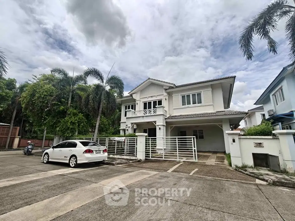 Spacious two-story house with modern design and ample parking in a serene neighborhood.