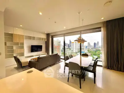 Luxurious open-plan living room with stunning city view, modern furnishings, and elegant dining area.