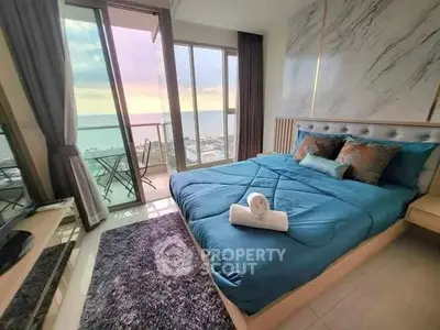 Luxurious bedroom with stunning ocean view and elegant decor