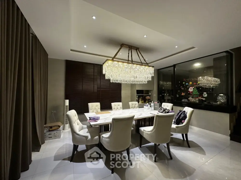 Luxurious dining room with elegant chandelier and plush seating