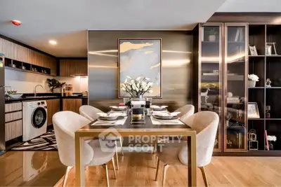 Luxurious open-plan kitchen and dining area with modern decor and washing machine.