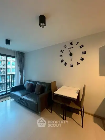 Modern living room with stylish wall clock and cozy seating area