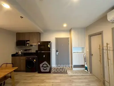 Modern kitchen with sleek appliances and open layout in a stylish apartment.