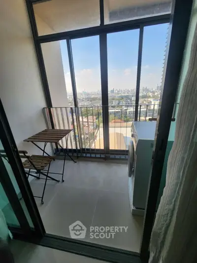 Charming balcony with city view and compact laundry area
