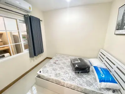 Cozy bedroom with air conditioning and modern decor in a bright apartment.