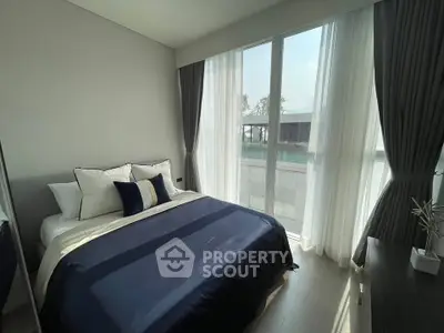 Bright and cozy bedroom with large windows and elegant decor