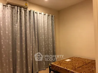 Cozy bedroom with air conditioning and elegant curtains