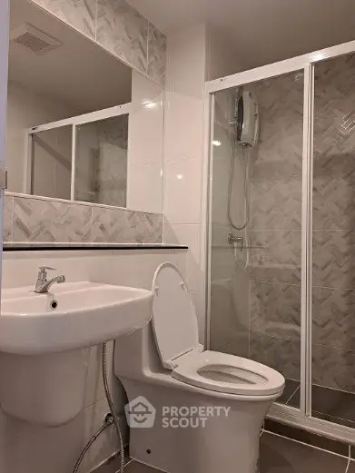 Modern bathroom with sleek shower and elegant tile design