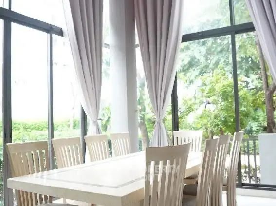 Elegant dining area with large windows and natural light